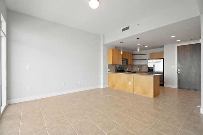 Another view showing living and kitchen space. | Image 8