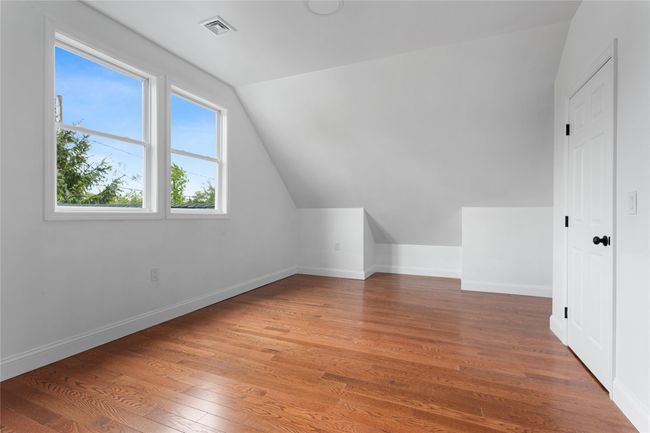 Bonus room with lofted ceiling, light wood finished floors, and baseboards | Image 11