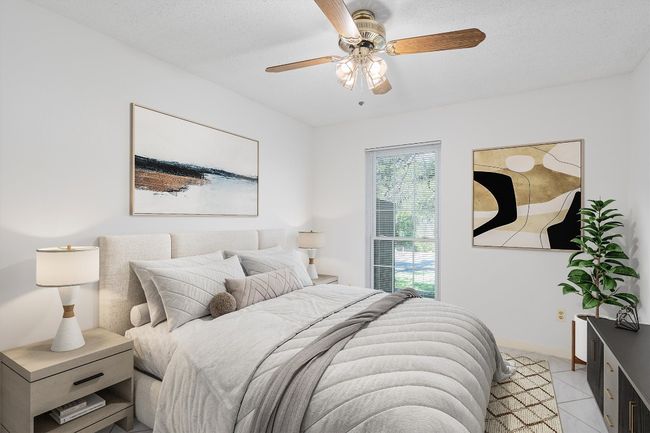 Bedroom featuring light tile patterned floors and ceiling fan | Image 30