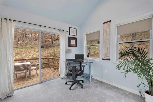 Den/Office space featuring baseboards and vaulted ceiling | Image 8