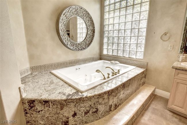 Full bath with a whirlpool tub and vanity | Image 30