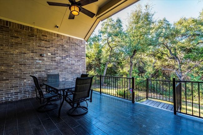 Texas Size back patio featuring wood-look tile | Image 36