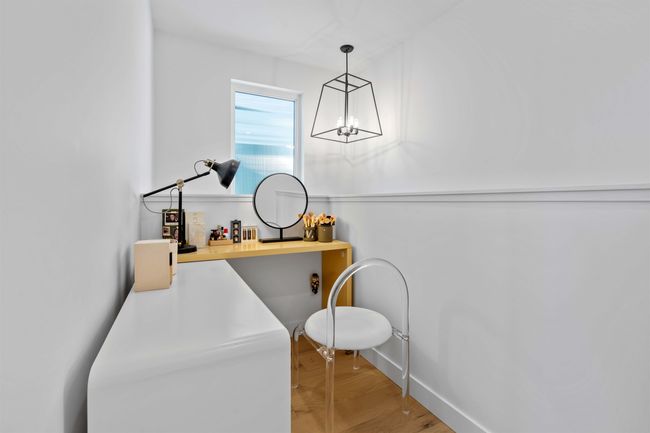 Interior space with baseboards, light wood-style floors, and a chandelier | Image 25