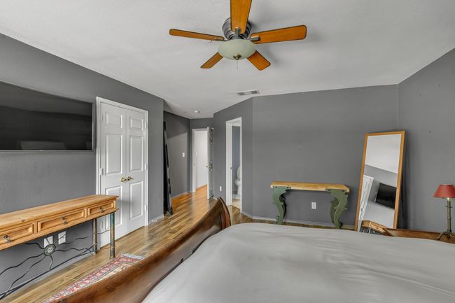 Bedroom featuring wood finished floors and a ceiling fan | Image 20
