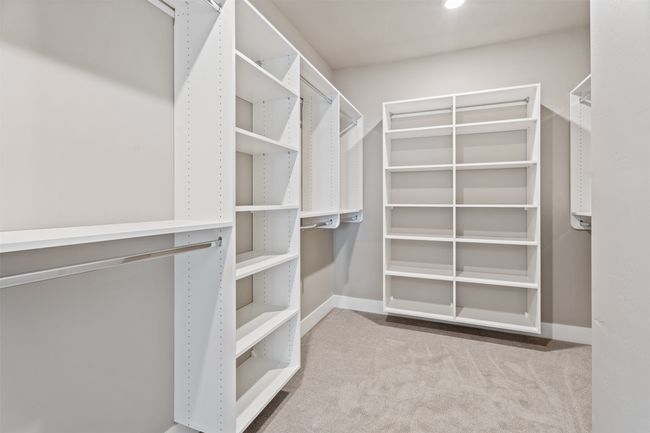 Spacious closet with carpet flooring | Image 21