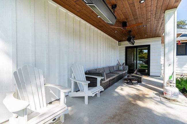 View of patio with an outdoor living space and ceiling fan | Image 25
