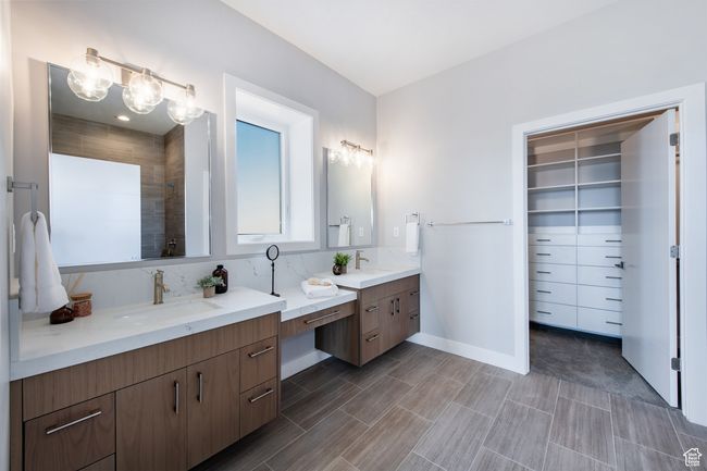 Bathroom with vanity and tiled shower | Image 11