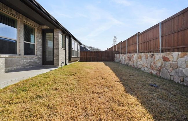 View of yard featuring a fenced backyard | Image 29