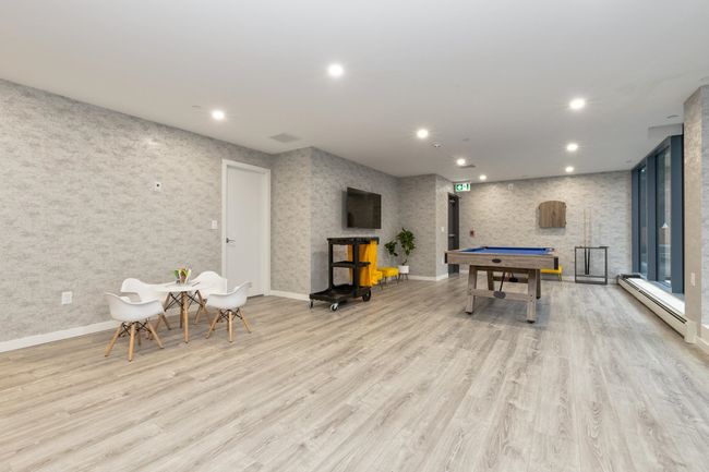 Playroom with baseboard heating, pool table, recessed lighting, wood finished floors, and baseboards | Image 19