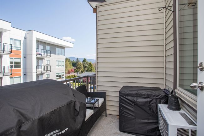 Balcony featuring a mountain view and grilling area | Image 14