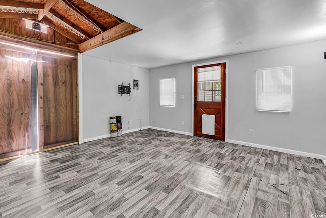 Unfurnished living room featuring wood finished floors | Image 30
