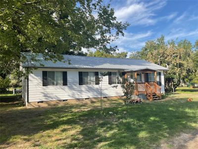 Ranch-style home with a front lawn | Image 2