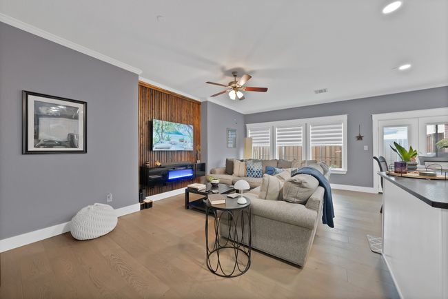 Living room featuring crown molding, ceiling fan, baseboards, wood finished floors, and recessed lighting | Image 16