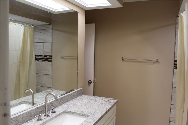 Bathroom featuring vanity | Image 11