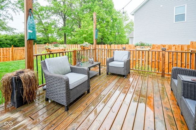 deck featuring a fenced backyard and heating unit | Image 7