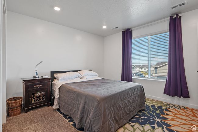 Bedroom with recessed lighting, carpet floors, visible vents, and baseboards | Image 8
