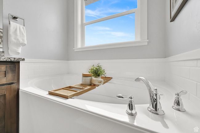Full bath featuring a garden tub and vanity | Image 26
