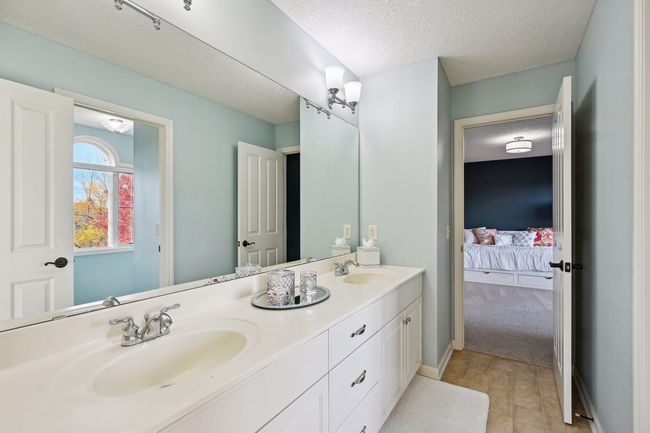 Jack and Jill bathroom connects two of the four upper level bathrooms | Image 49