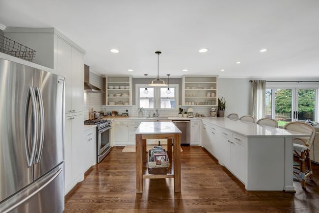 The definition of Open Concept this Beautifully appointed w Custom Cabinets and new lighting | Image 11
