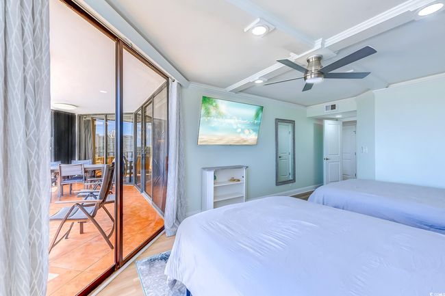Bedroom with crown molding, ceiling fan, and light hardwood / wood-style floors | Image 24