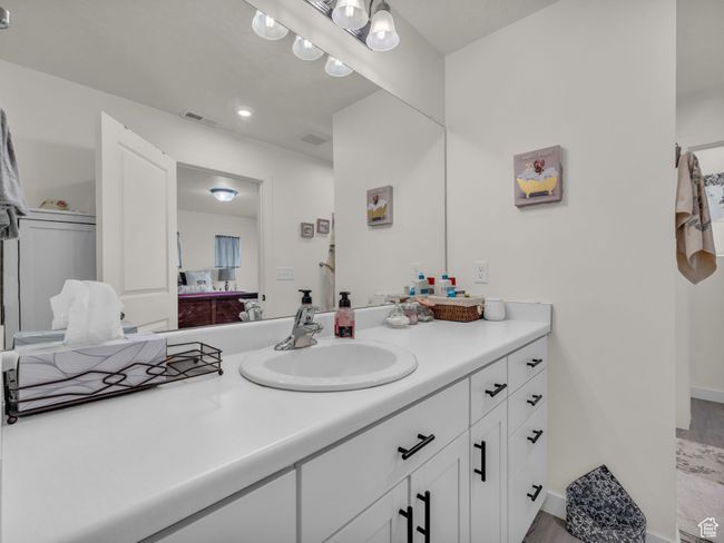 Bathroom with vanity, wood finished floors, and recessed lighting | Image 21