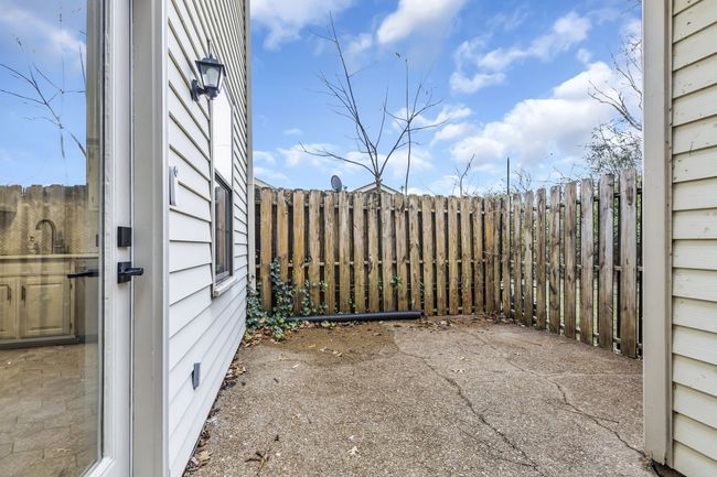 Privacy fenced patio is a perfect spot to grill out. | Image 17