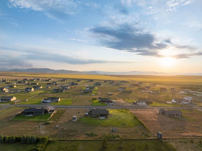 Aerial view of property's location featuring a mountainous background and nearby suburban area | Image 35