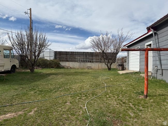 View of yard featuring fence | Image 4