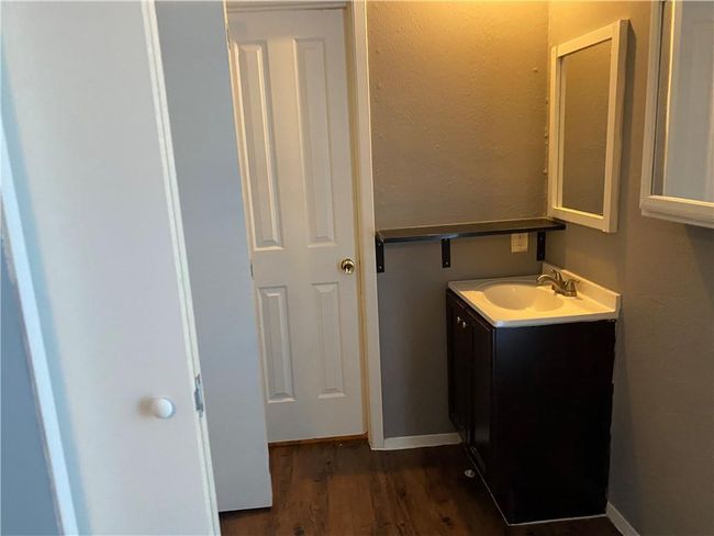 Bathroom featuring vanity and wood finished floors | Image 8