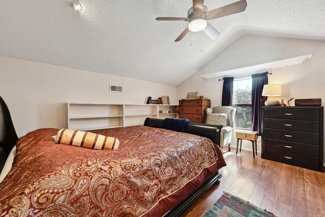 Owner's retreat upstairs with half bath, walk in closet and flex space. | Image 13