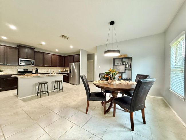 Kitchen opens to Family Room & Dining Room | Image 18