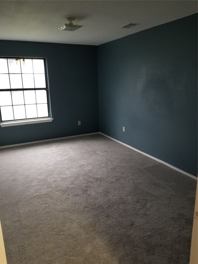 Spare room featuring carpet floors and baseboards | Image 14