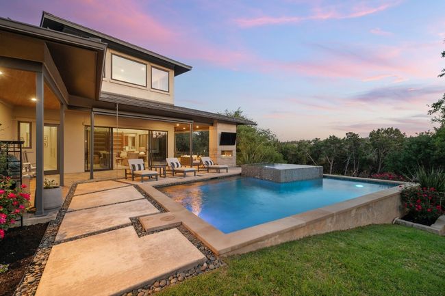 View of pool with a jacuzzi, an infinity pool, and a patio | Image 32