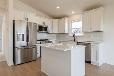 Photo is of the actual home. Imagine cooking a meal in this wonderful kitchen! | Image 3