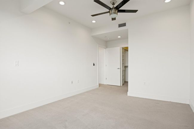 Unfurnished room with recessed lighting, light colored carpet, and a ceiling fan | Image 20