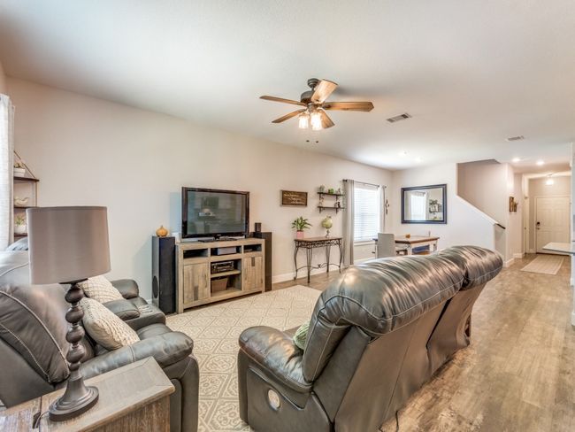 Living area featuring ceiling fan, light wood-style flooring, and recessed lighting | Image 5