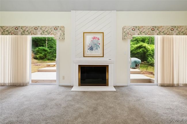 Unfurnished living room featuring carpet floors | Image 7