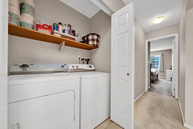 Washroom featuring light carpet, laundry area, baseboards, and independent washer and dryer | Image 21