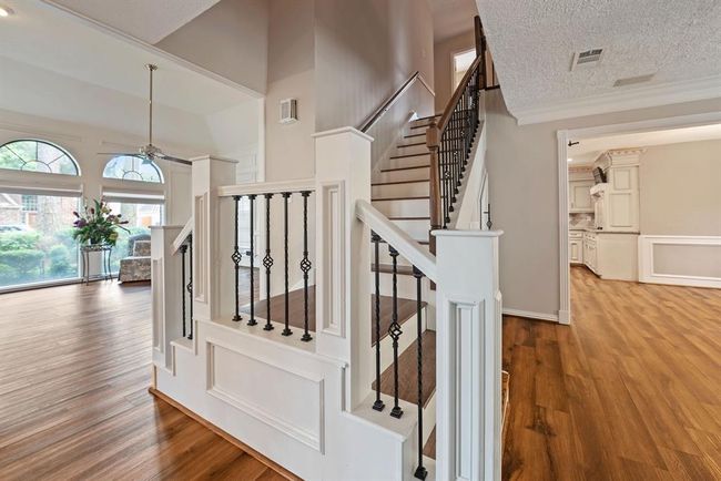 Head up the beautiful wrought iron staircase to check out the bedrooms from either of the living spaces | Image 23