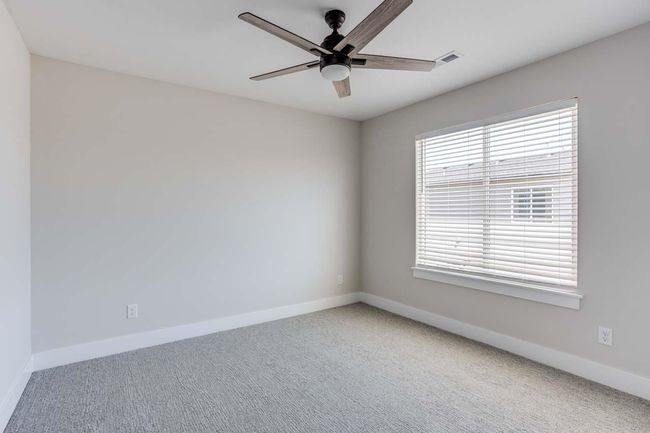 Carpeted spare room with a ceiling fan and baseboards | Image 17