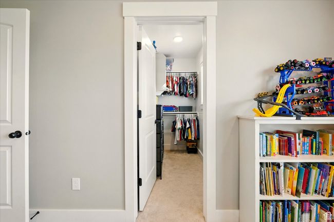 Corridor with light carpet and baseboards | Image 16