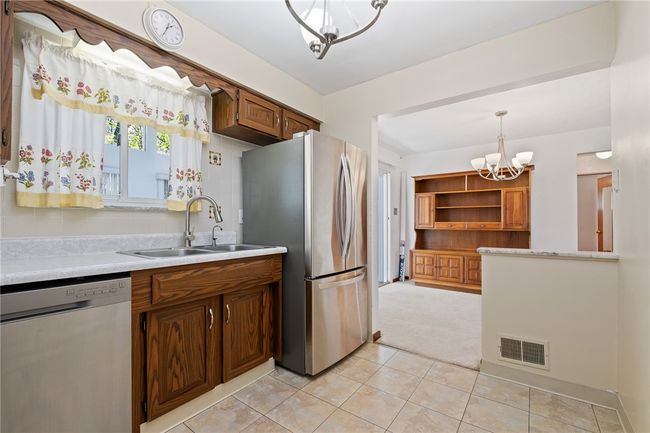 The Kitchen Also Opens To The Dining Room | Image 9