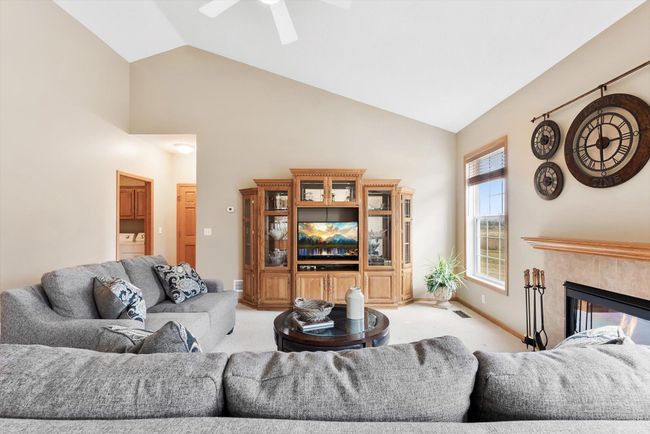 Open-concept design connects the living room with the dining area and kitchen, creating a perfect space for entertaining or everyday living. | Image 7
