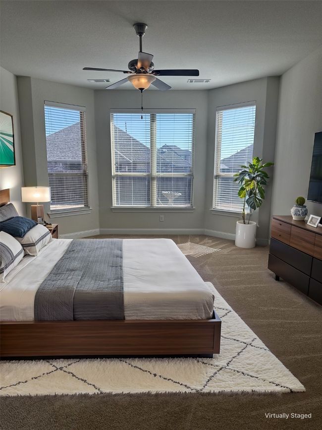 Bedroom with carpet, multiple windows, visible vents, and baseboards | Image 13