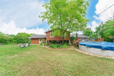 View of yard featuring a covered pool | Image 3