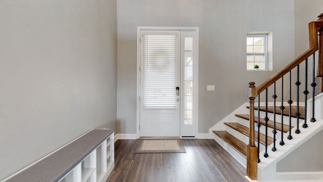 Entry foyer - wrought iron spindles and wood treads | Image 7