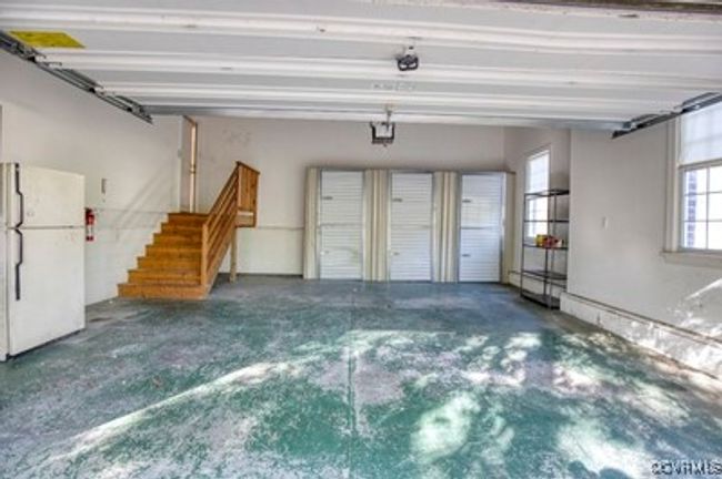Garage with freestanding refrigerator | Image 33
