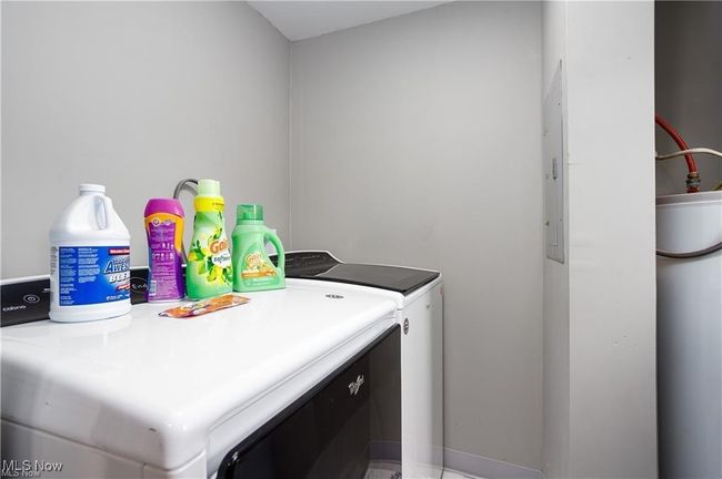 Clothes washing area with washer and clothes dryer and laundry area | Image 15