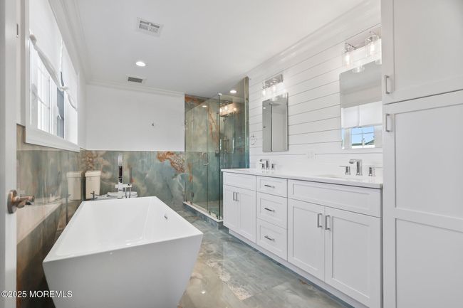 primary bath, soaking tub, double vanity, walk-in shower, excess storage | Image 28