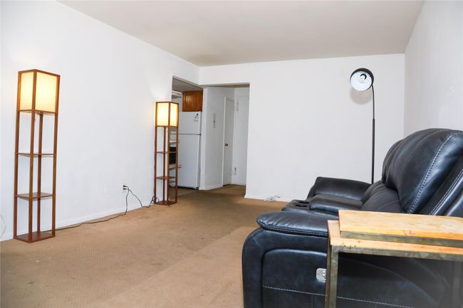 Living area featuring light colored carpet | Image 6